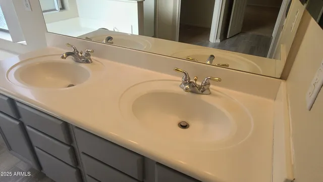 a bathroom with bathtub and shower