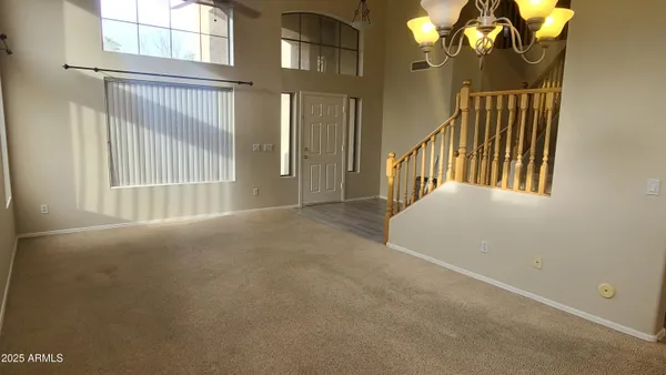a view of a kitchen with a sink and cabinets