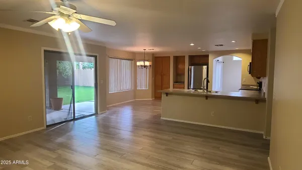a kitchen with stainless steel appliances granite countertop a refrigerator stove and sink