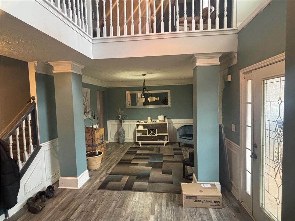 526 Canady Court Hampton, GA 30228 - Photo 3 of 10 a view of a hallway with wooden floor and staircase