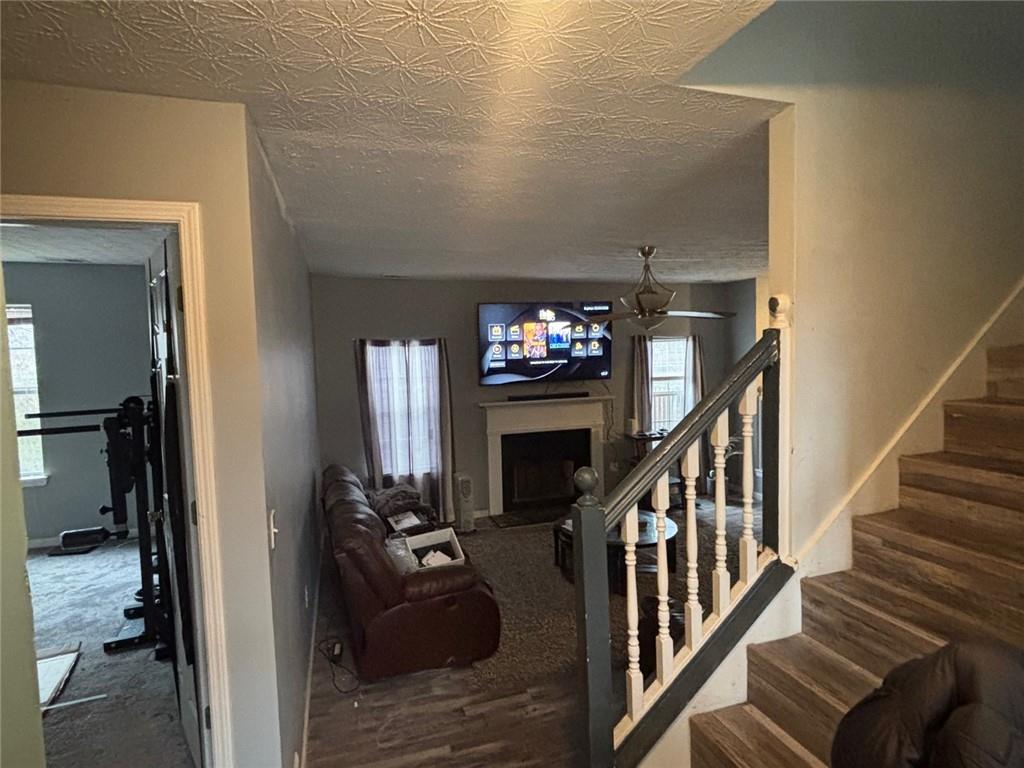 526 Canady Court Hampton, GA 30228 - Photo 5 of 10 a view of a livingroom with furniture and stairs