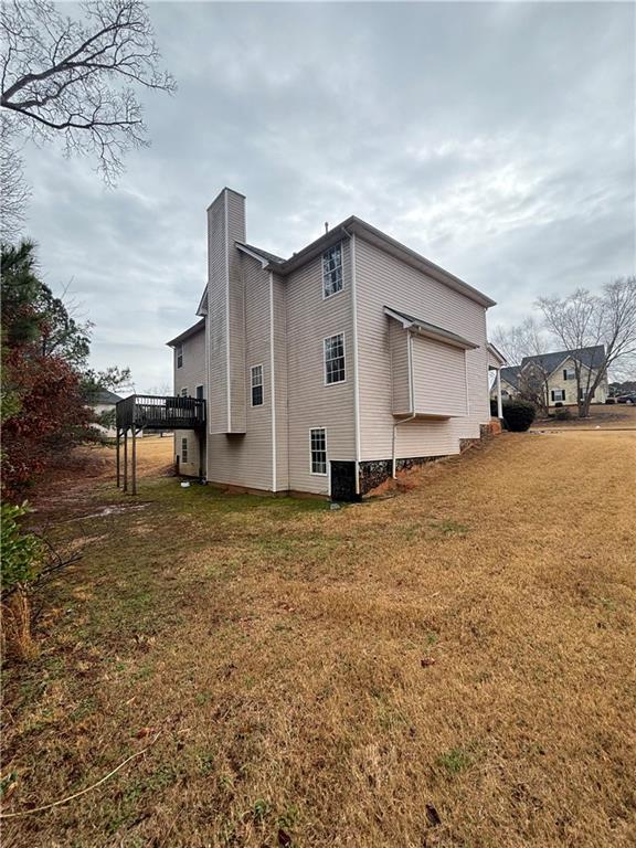 526 Canady Court Hampton, GA 30228 - Photo 10 of 10 a view of a house with backyard and a tree