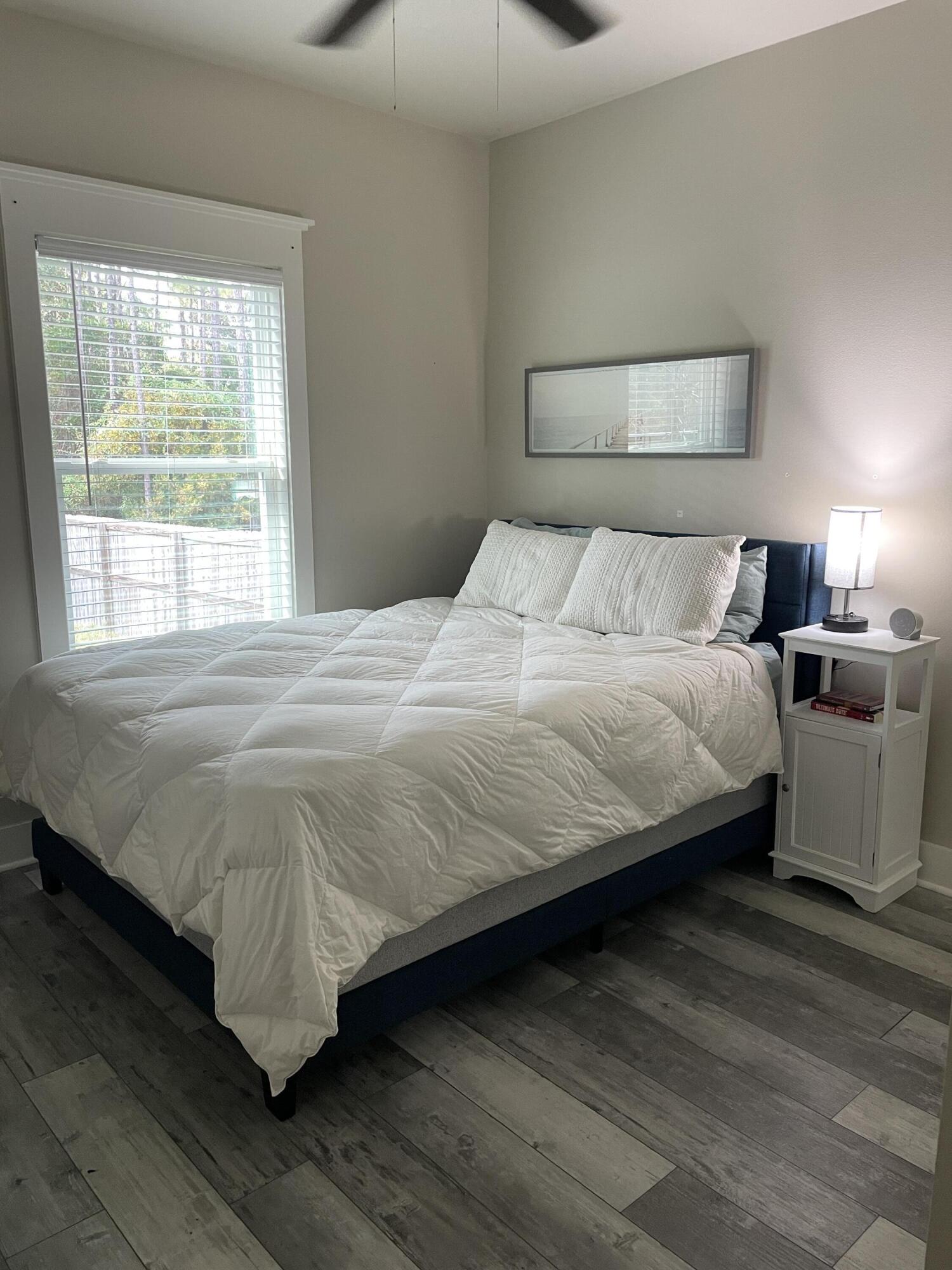 105 1st Street Santa Rosa Beach, FL 32459 - Photo 15 of 35 a bedroom with a bed and a night stand