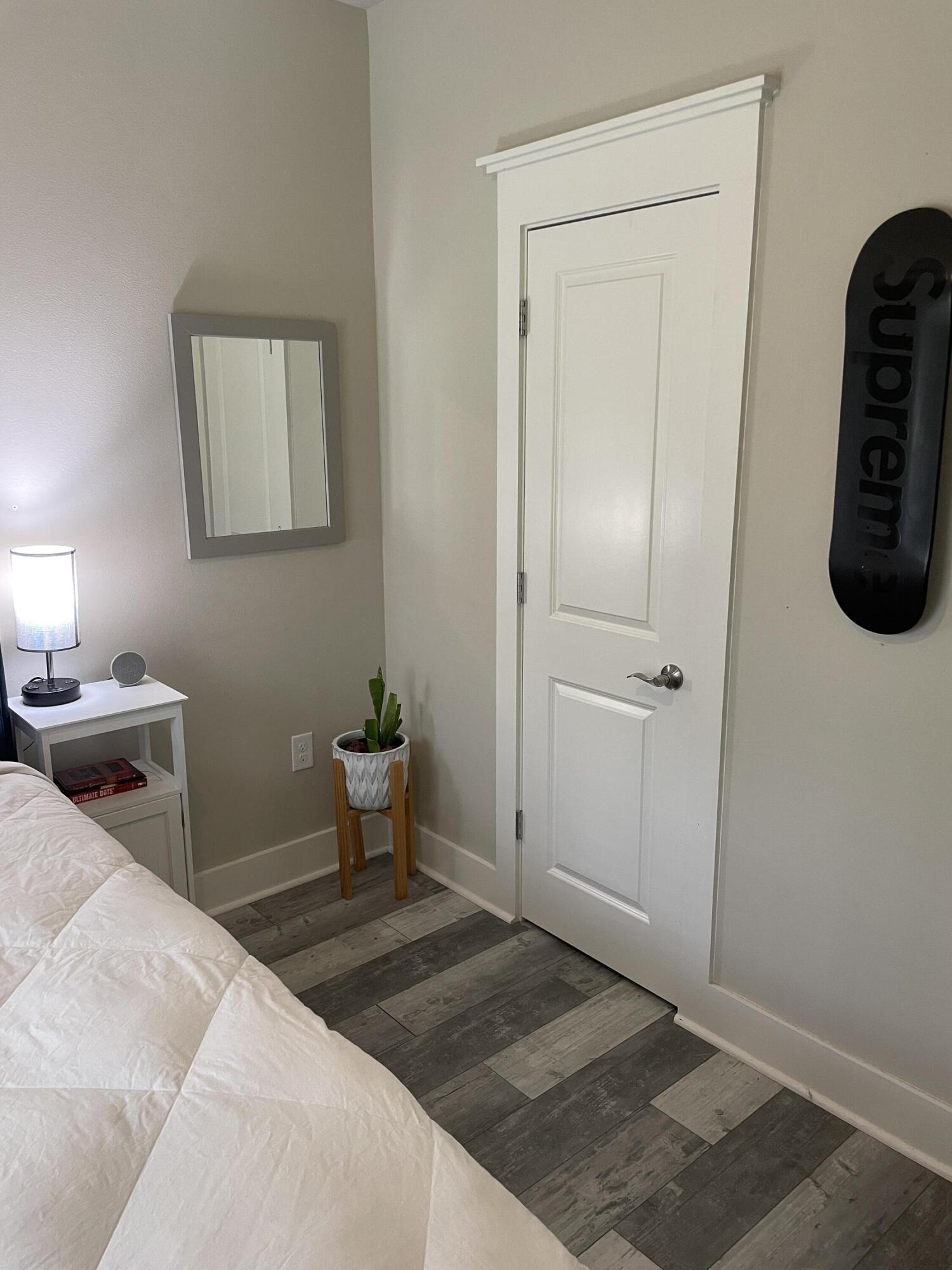 105 1st Street Santa Rosa Beach, FL 32459 - Photo 17 of 35 a bedroom with a bed and painting on the wall