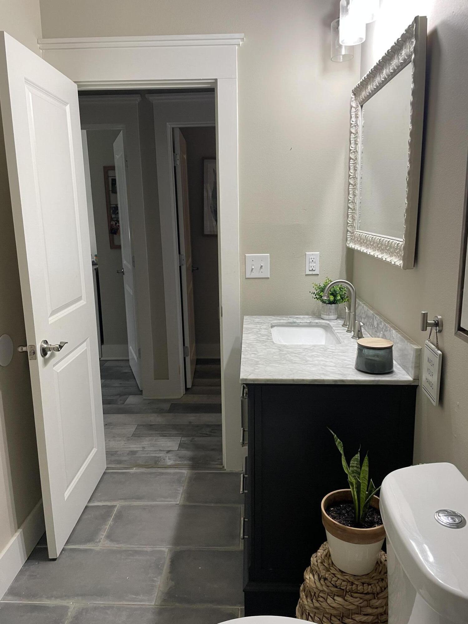 105 1st Street Santa Rosa Beach, FL 32459 - Photo 21 of 35 a bathroom with a sink a toilet and shower