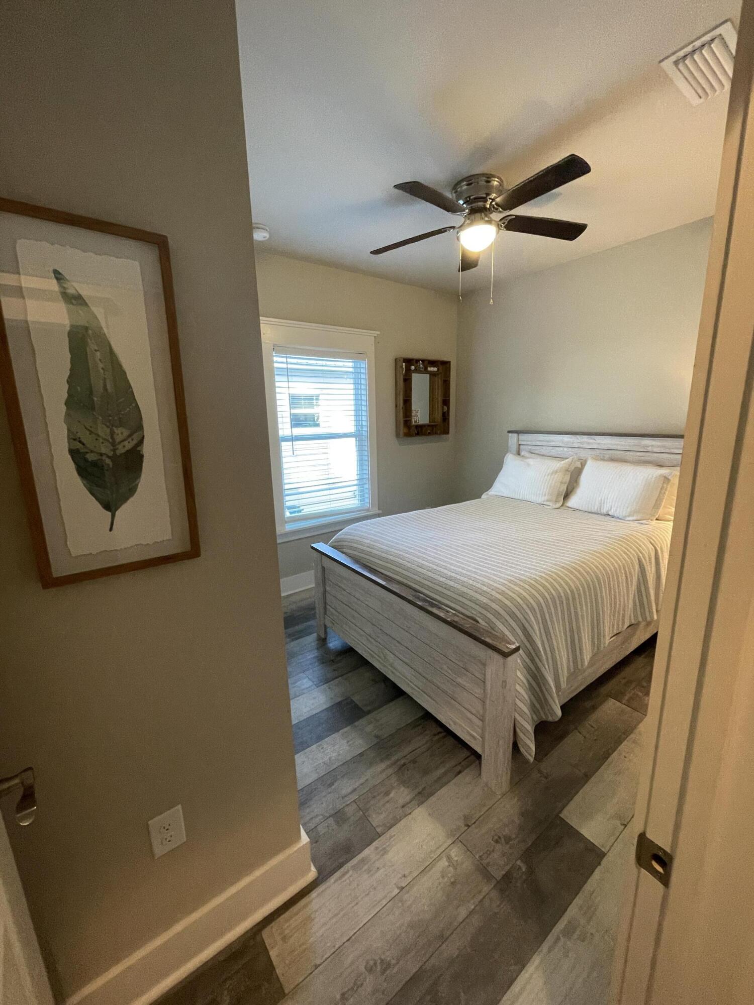105 1st Street Santa Rosa Beach, FL 32459 - Photo 23 of 35 a bedroom with a bed and a window