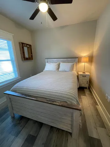 a bedroom with a bed and window