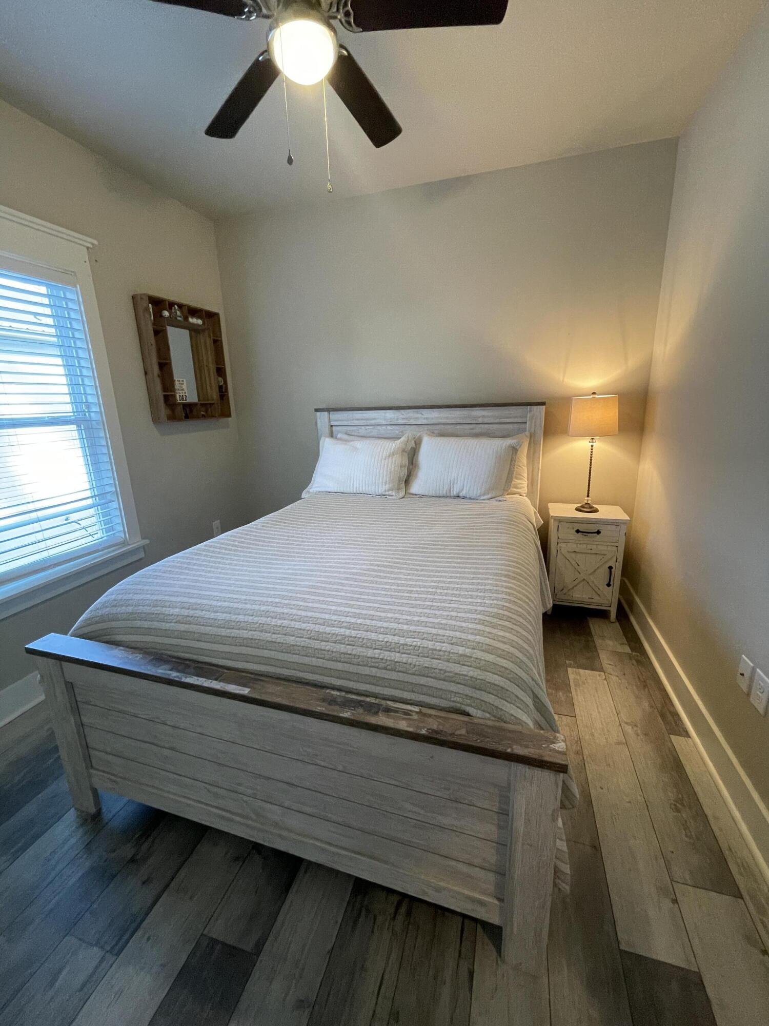 105 1st Street Santa Rosa Beach, FL 32459 - Photo 24 of 35 a bedroom with a bed and window