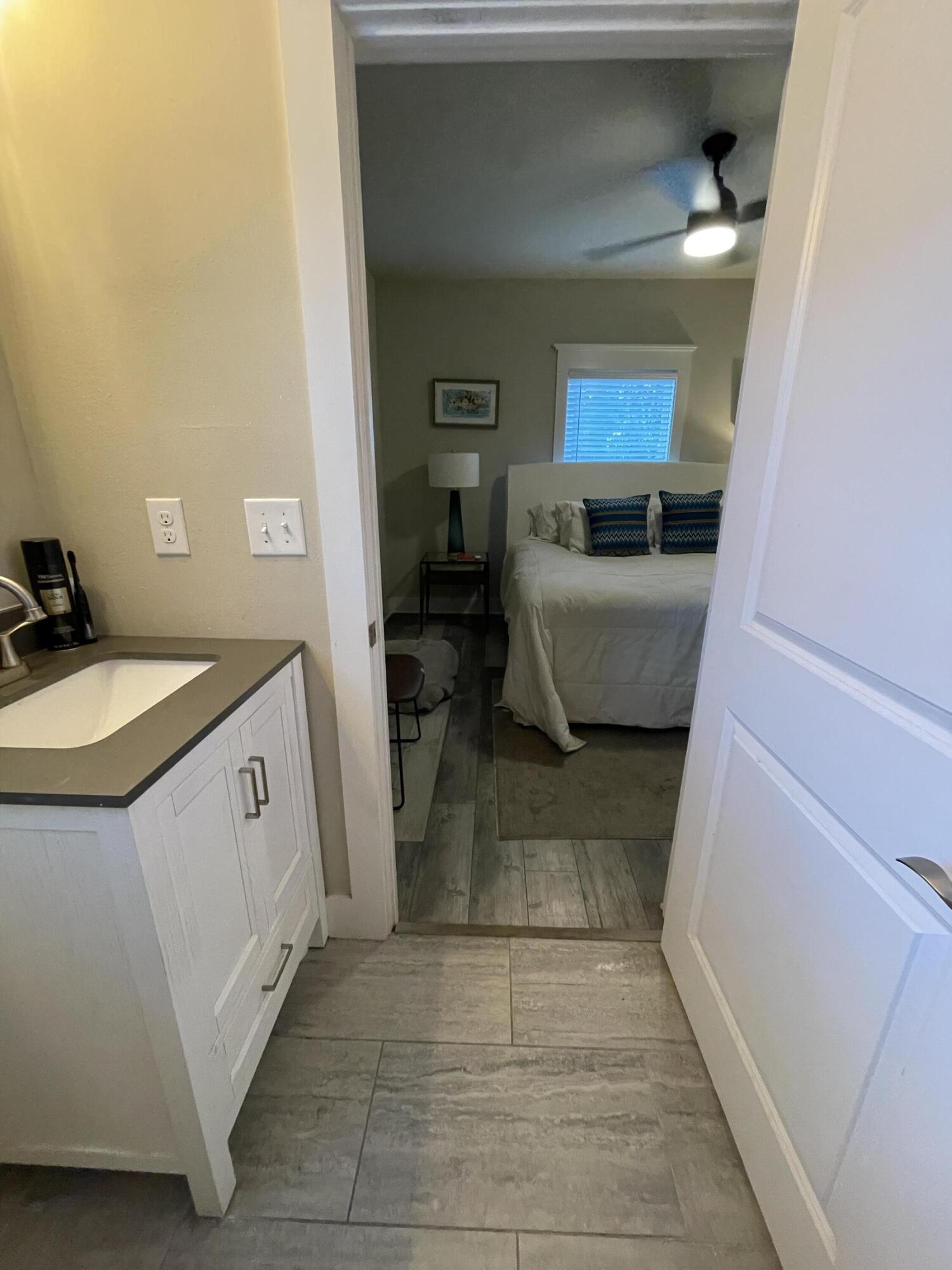 105 1st Street Santa Rosa Beach, FL 32459 - Photo 30 of 35 a bathroom with a sink a toilet and mirror