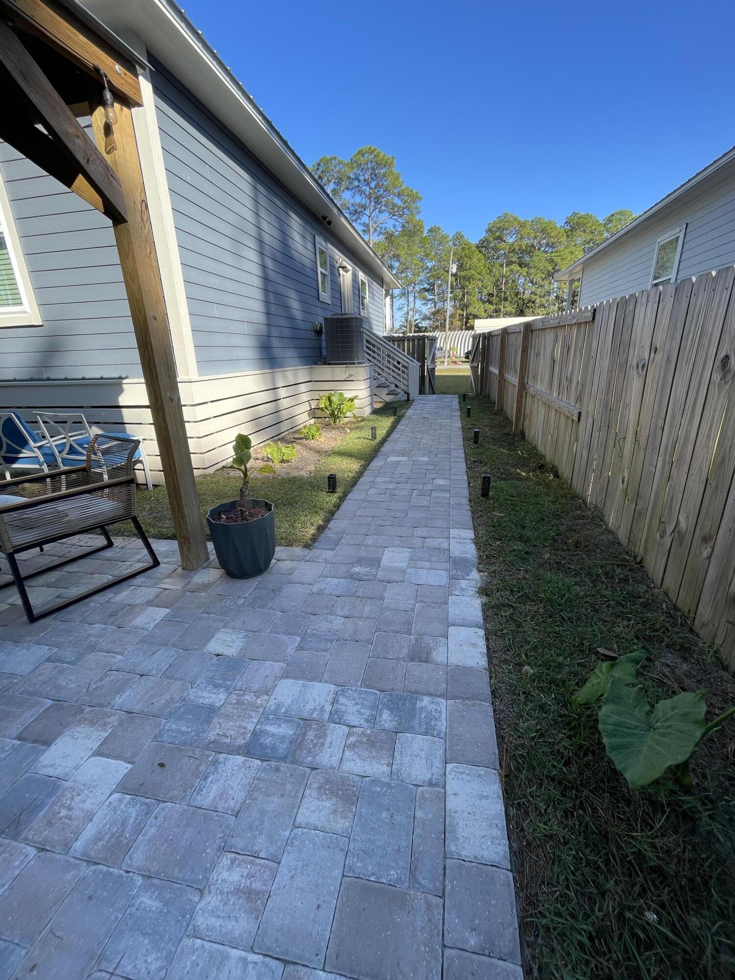 105 1st Street Santa Rosa Beach, FL 32459 - Photo 32 of 35 a view of a backyard with pathway
