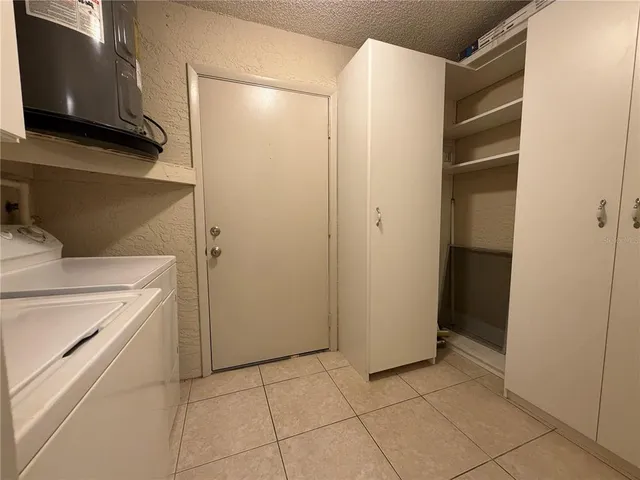 a view of storage and utility room with washer and dryer