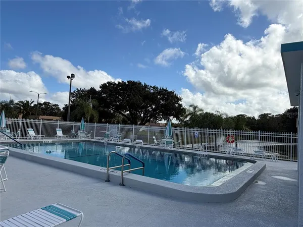 a view of a swimming pool with a terrace