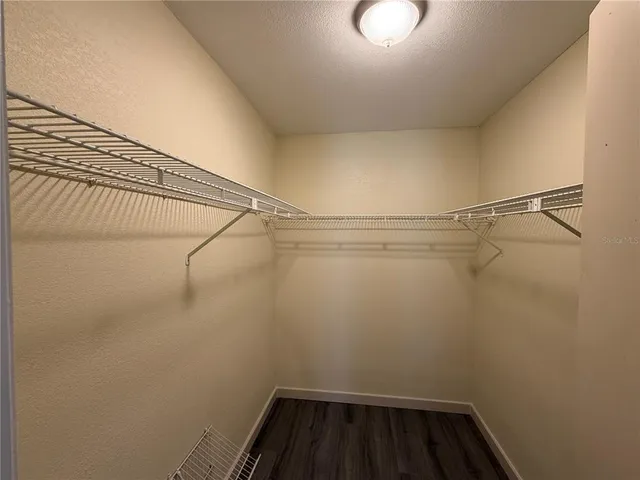 a view of a room with racks on the wall