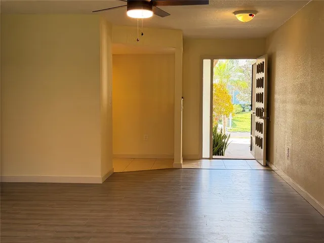 a view of a room with furniture and a window