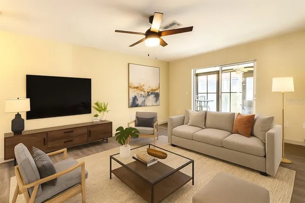 a living room with furniture and a flat screen tv