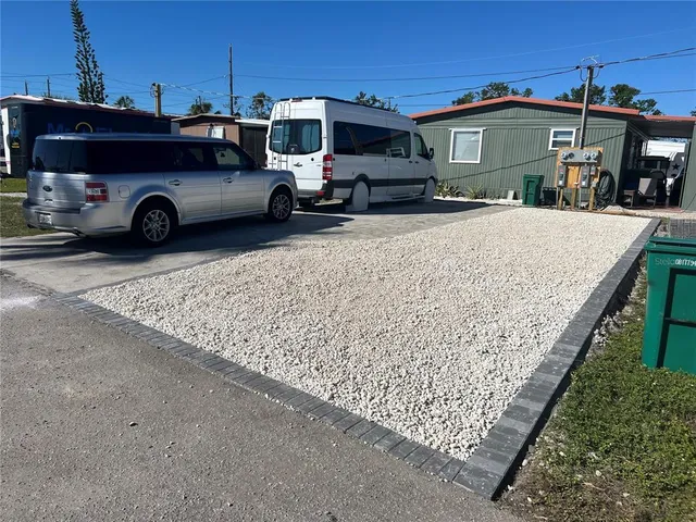 a view of car parked in front of a house