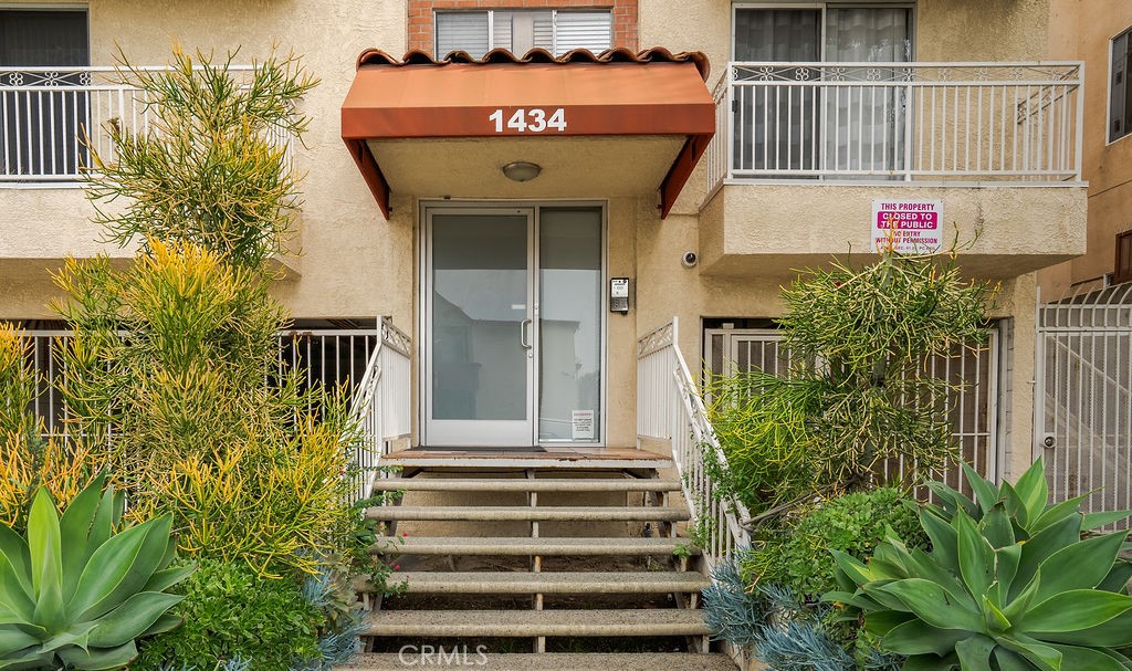 1434 South Point View Street Los Angeles, CA 90035 - Photo 11 of 11 a view of a house with a small yard and plants