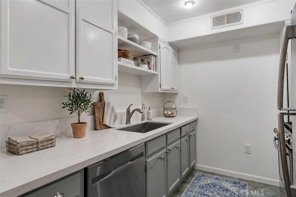 1434 South Point View Street Los Angeles, CA 90035 - Photo 2 of 11 a kitchen with a sink and cabinets