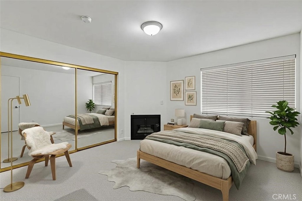 1434 South Point View Street Los Angeles, CA 90035 - Photo 3 of 11 a bedroom with a bed and a couch