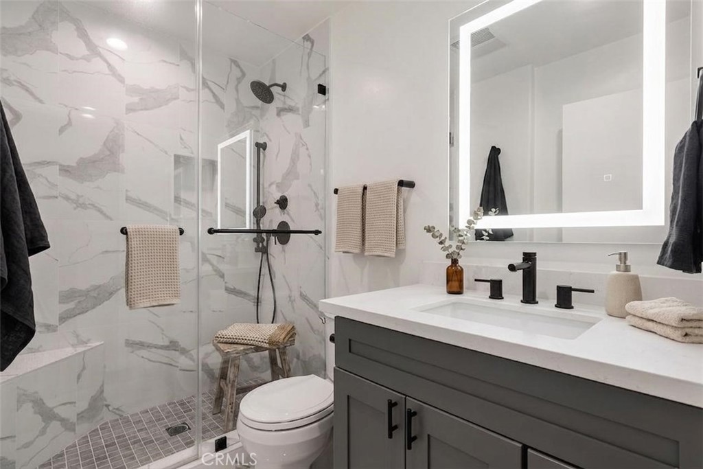 1434 South Point View Street Los Angeles, CA 90035 - Photo 5 of 11 a bathroom with a sink a toilet and shower