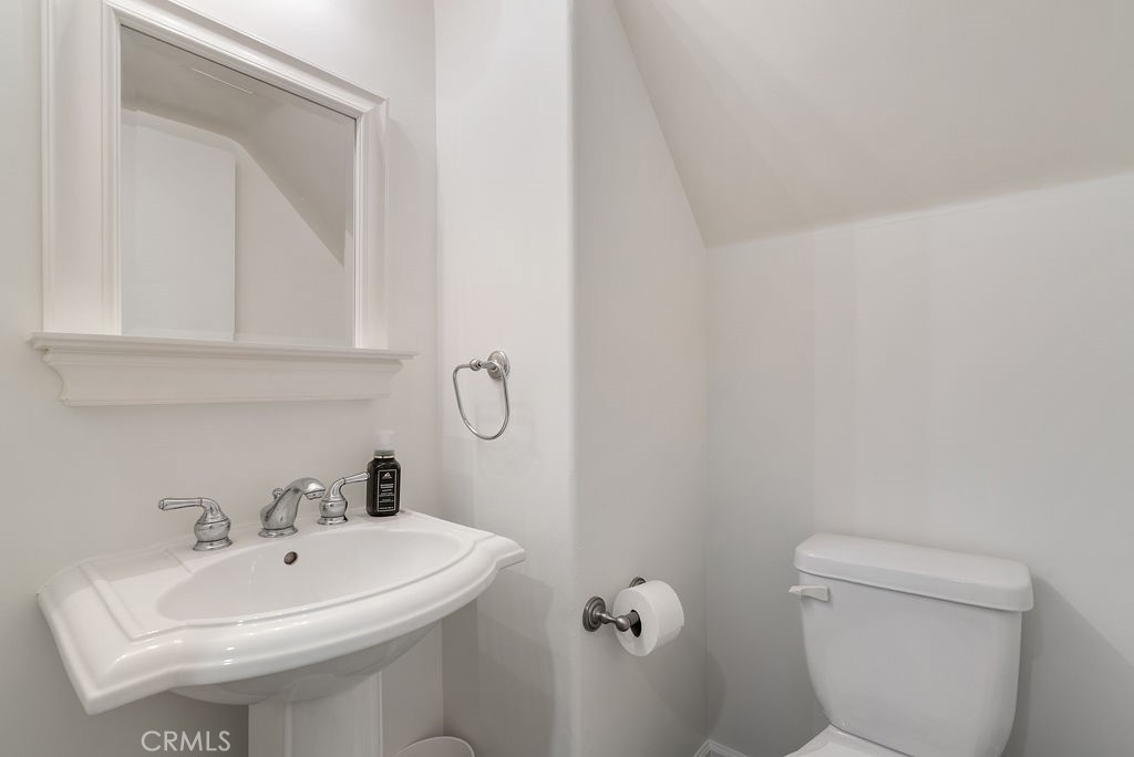 1434 South Point View Street Los Angeles, CA 90035 - Photo 7 of 16 a bathroom with a toilet sink and mirror