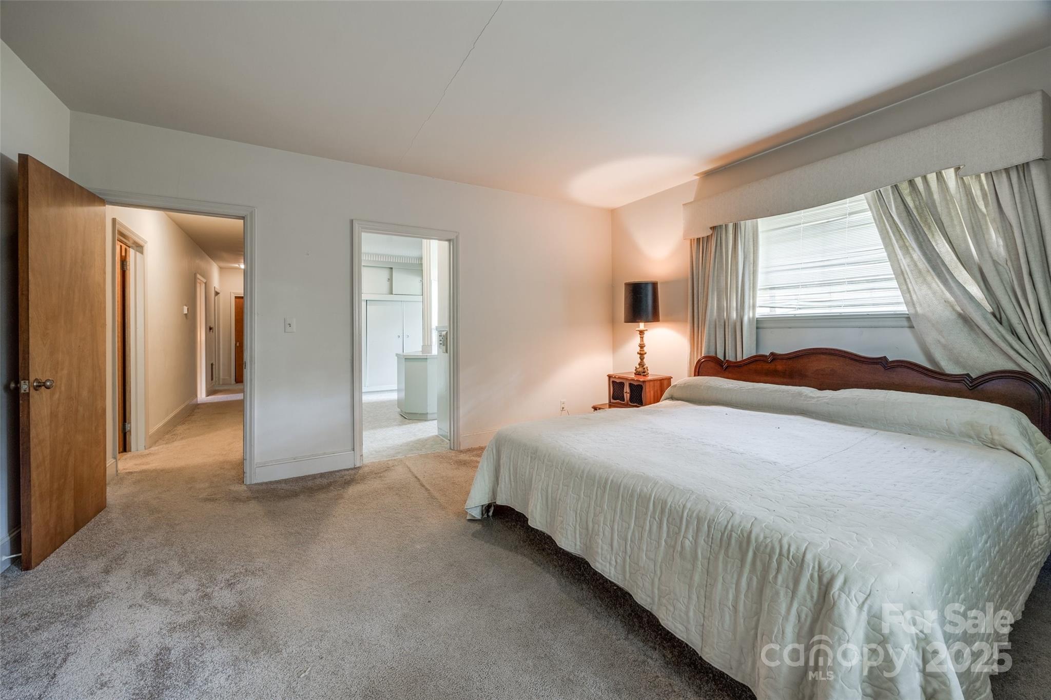 3330 Foxcroft Road Charlotte, NC 28211 - Photo 15 of 39 a bedroom with bed and window