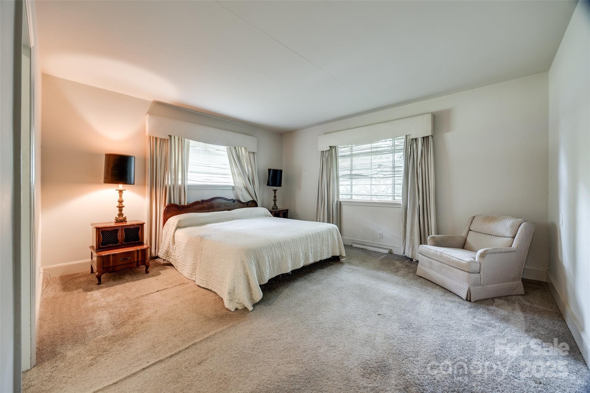 3330 Foxcroft Road Charlotte, NC 28211 - Photo 16 of 39 a bedroom with a bed and a couch