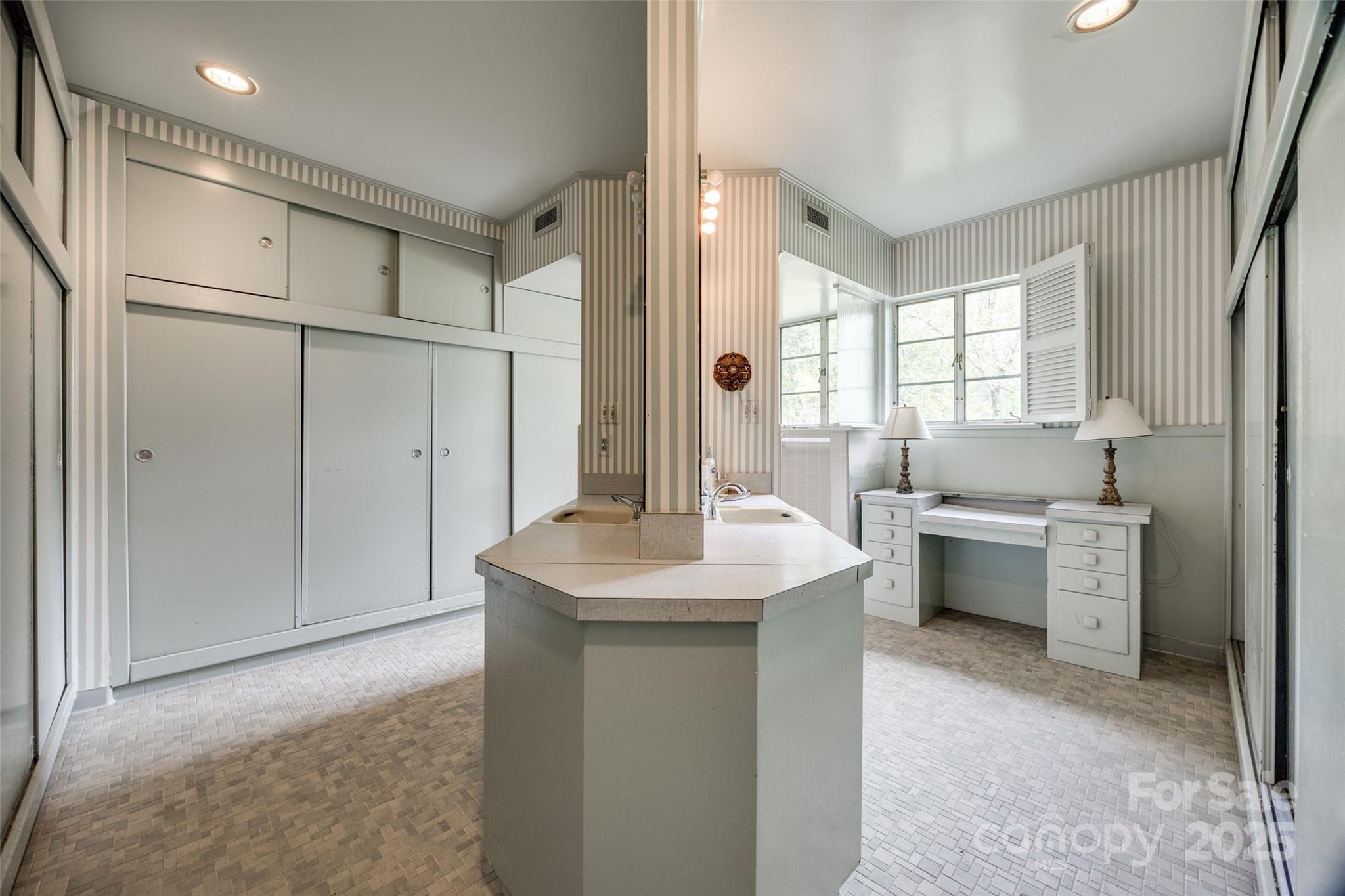 3330 Foxcroft Road Charlotte, NC 28211 - Photo 18 of 39 a kitchen with a sink and a refrigerator
