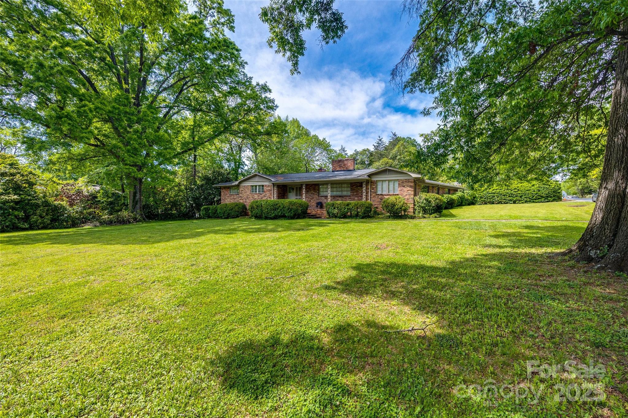 3330 Foxcroft Road Charlotte, NC 28211 - Photo 30 of 39 a view of a house with a big yard