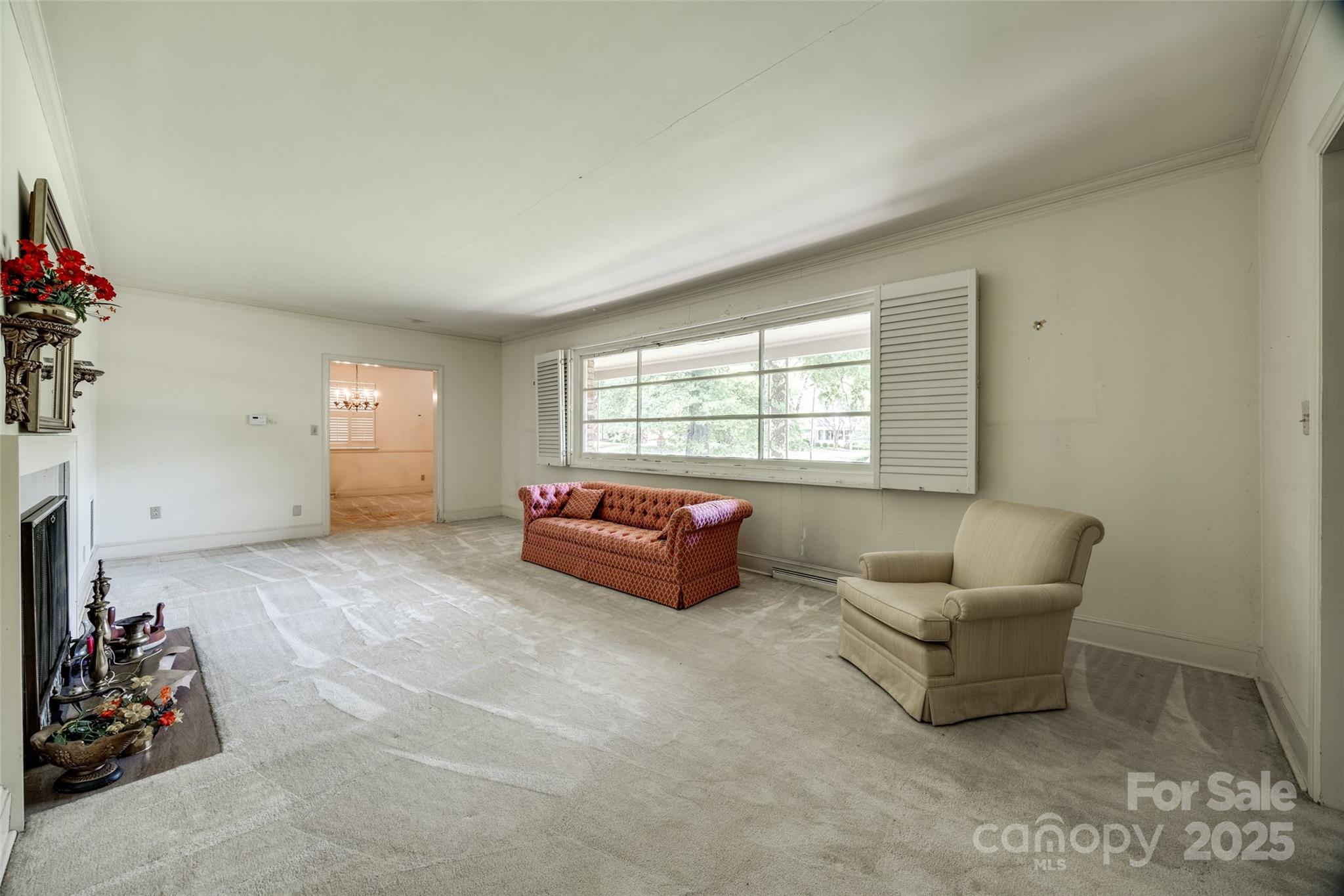 3330 Foxcroft Road Charlotte, NC 28211 - Photo 3 of 39 a living room with furniture and a window