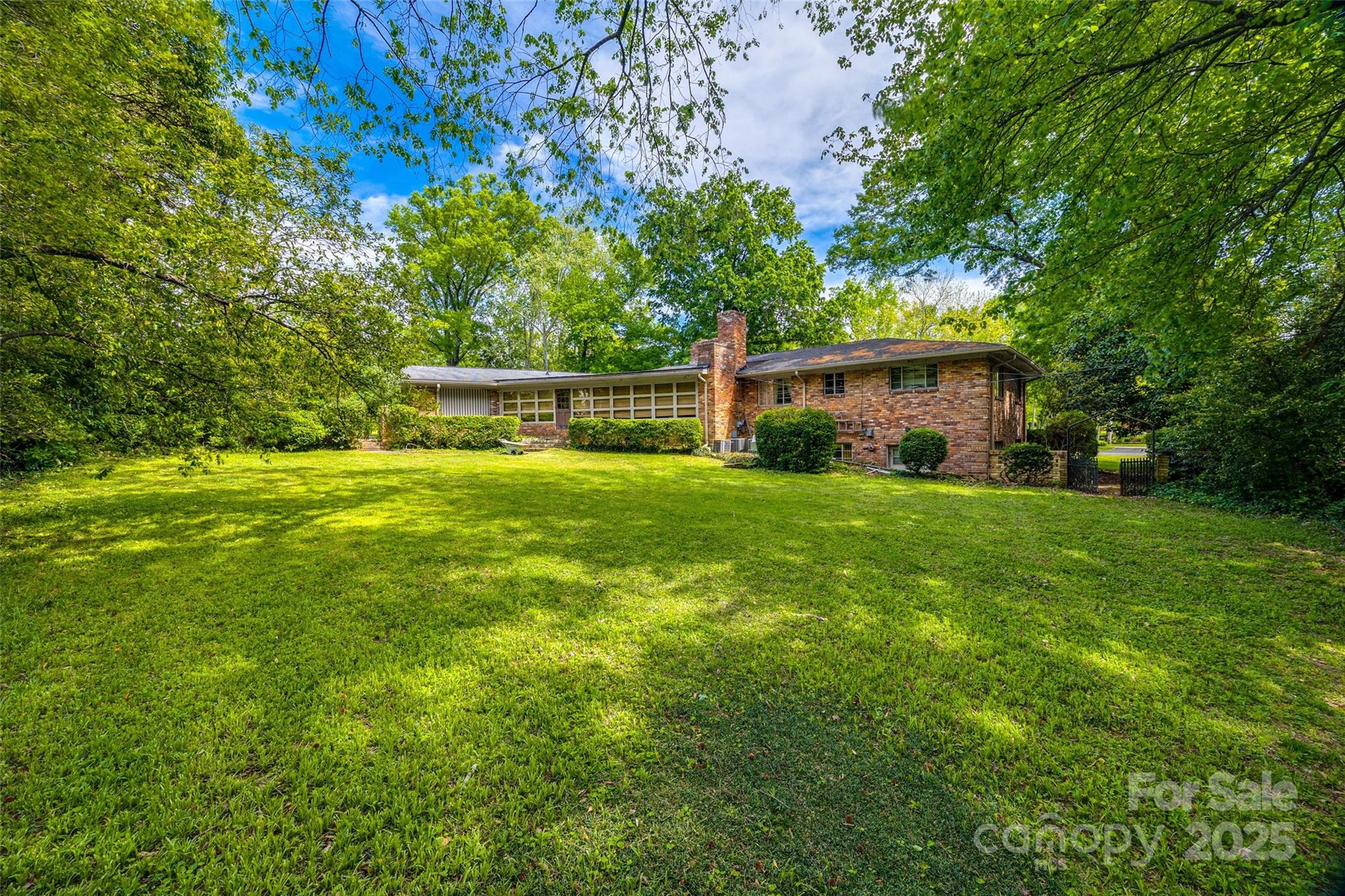 3330 Foxcroft Road Charlotte, NC 28211 - Photo 32 of 39 a view of a house with a yard