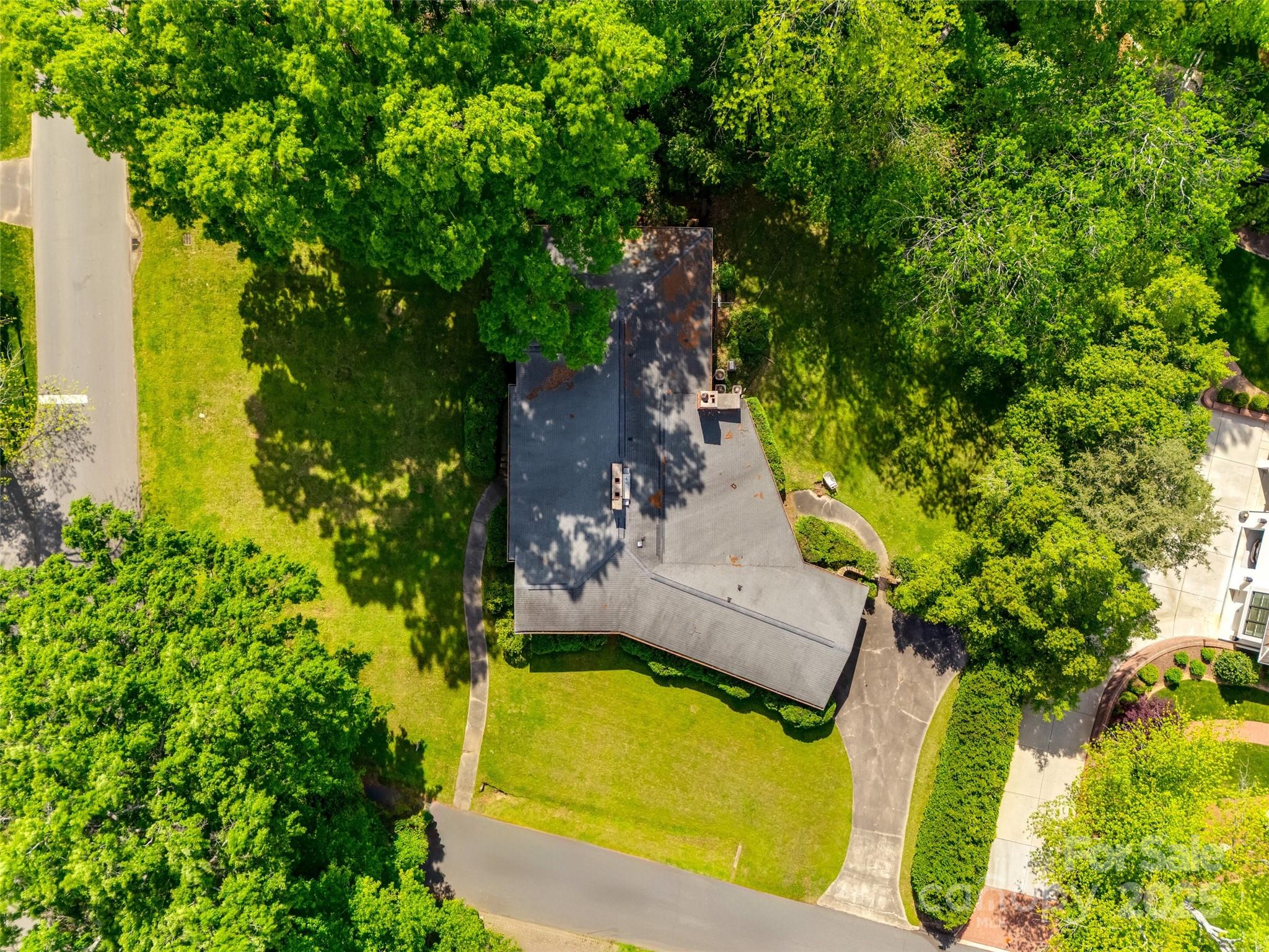 3330 Foxcroft Road Charlotte, NC 28211 - Photo 36 of 39 an aerial view of a house with swimming pool and large trees