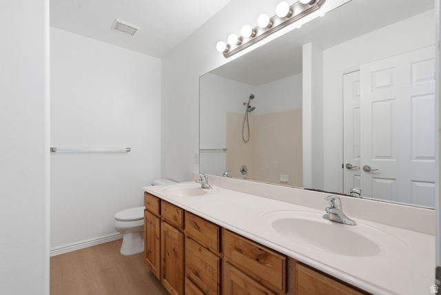 793 North 150 E Street Springville, UT 84663 - Photo 14 of 26 Dual vanity with light wood-finish cabinetry and integrated sinks