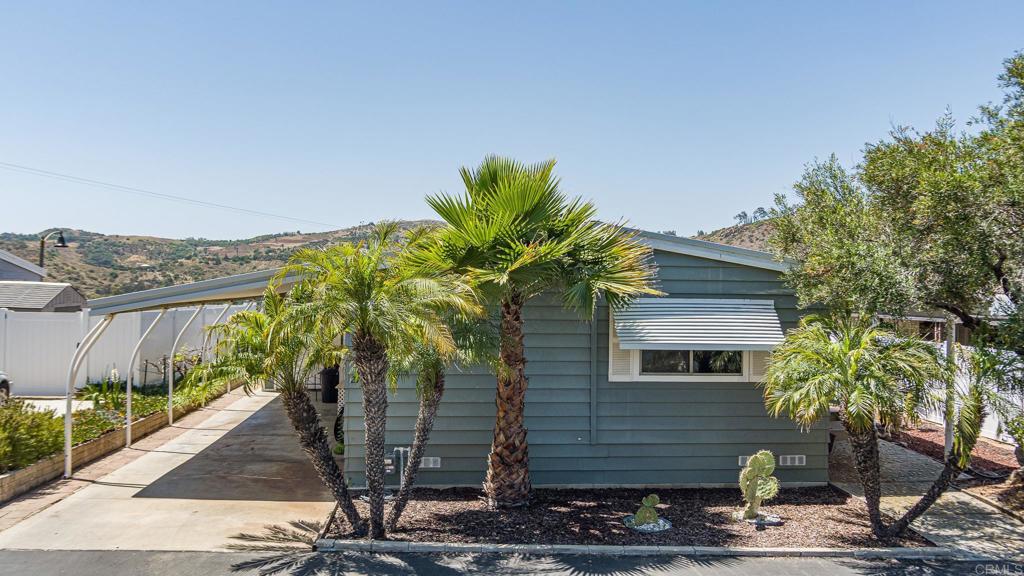 4650 Dulin Road, Unit 27 Fallbrook, CA 92003 - Photo 1 of 37 a plant that is sitting in front of a house