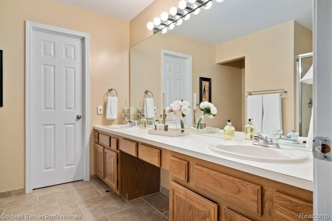 495 Bolinger Street Rochester, MI 48307 - Photo 18 of 30 Master bath with double sinks and tile flooring.