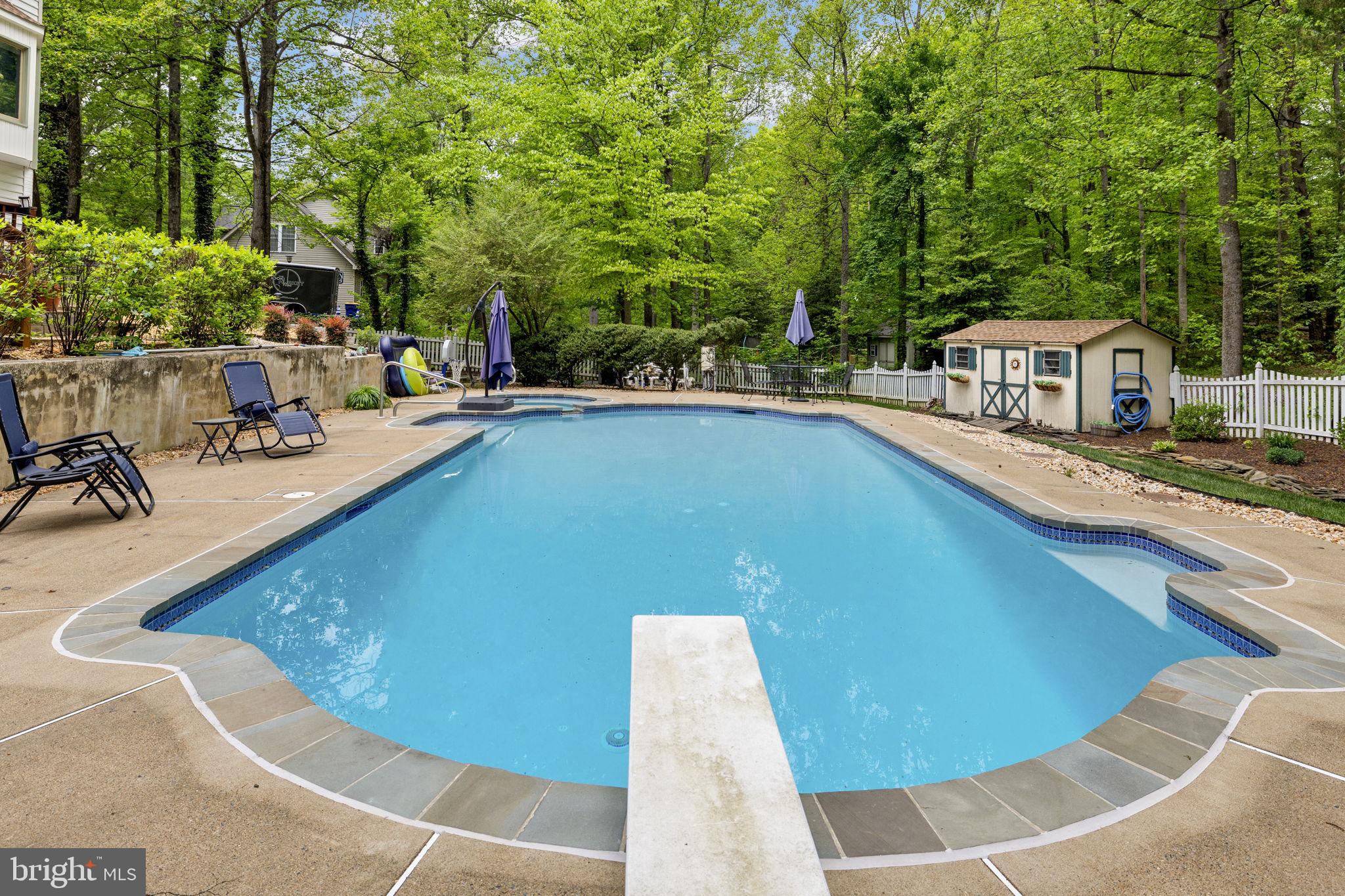 100 Boscobel Road Fredericksburg, VA 22405 - Photo 7 of 67 a view of a swimming pool with chairs