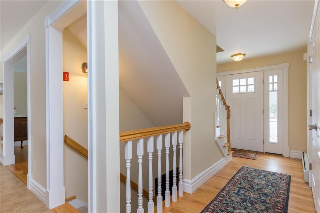 61 Old Field Road Yarmouth, ME 04096 - Photo 16 of 35 The stairs off the kitchen lead to a...