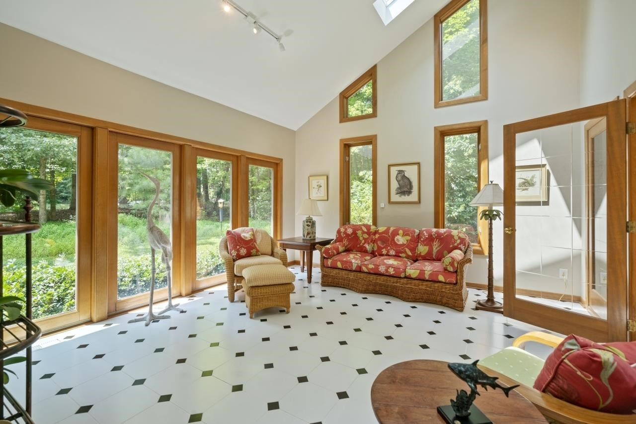 1932 Partridge Berry Drive Raleigh, NC 27606 - Photo 6 of 30 French Doors ~ Vaulted Ceiling ~ Sky Lights ~ Surrounded by Windows