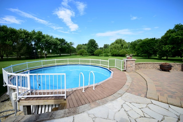 S950 Spring Green Way Batavia, IL 60510 - Photo 23 of 25 a view of a swimming pool with a lounge chair