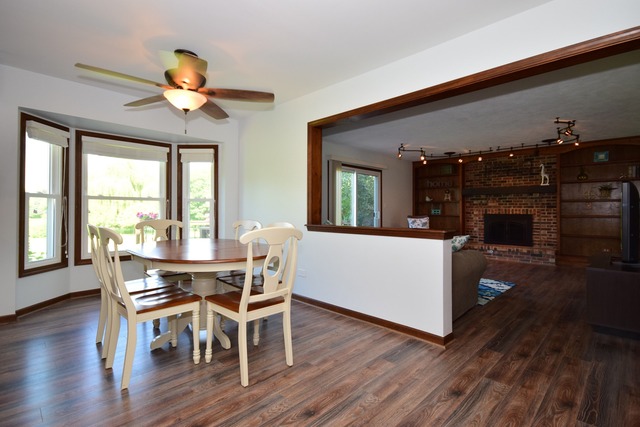 S950 Spring Green Way Batavia, IL 60510 - Photo 9 of 25 a view of a dining room with furniture and wooden floor