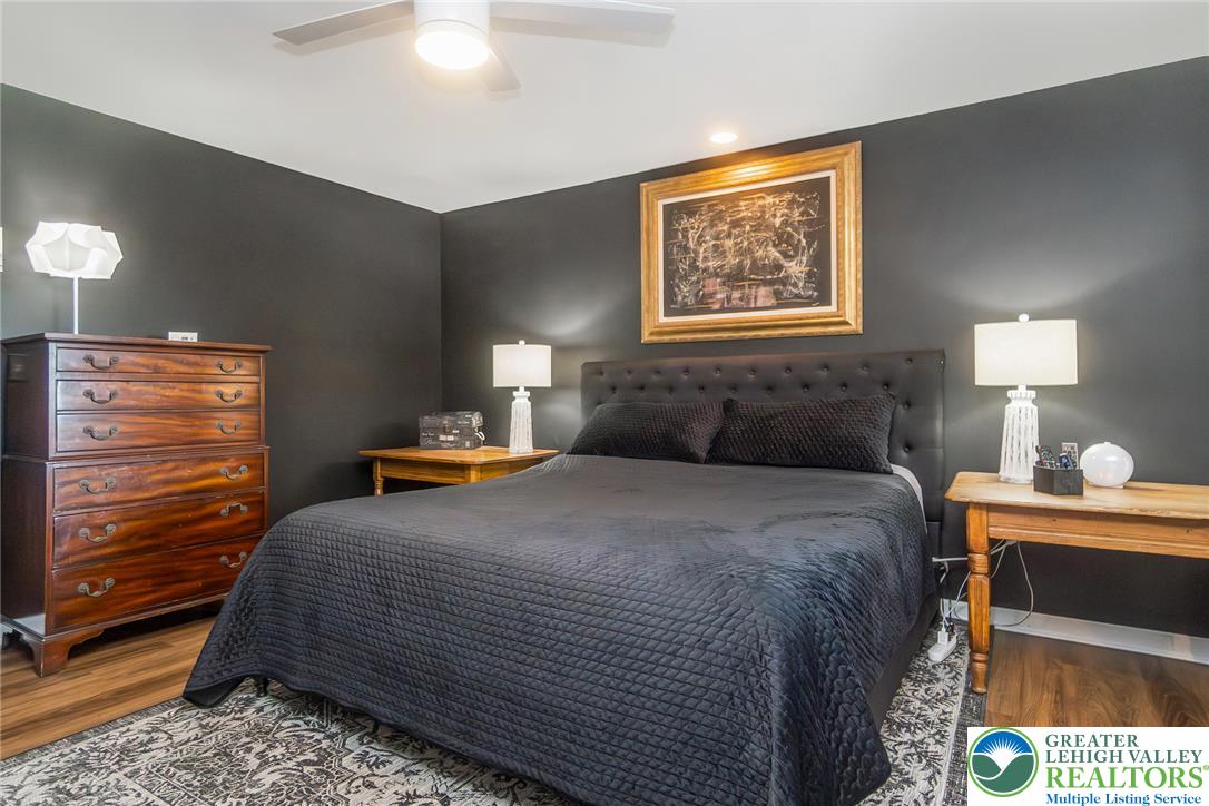 540 Briar Road Pen Argyl, PA 18072 - Photo 29 of 66 Plank floors and dark walls create a cozy bedroom retreat.