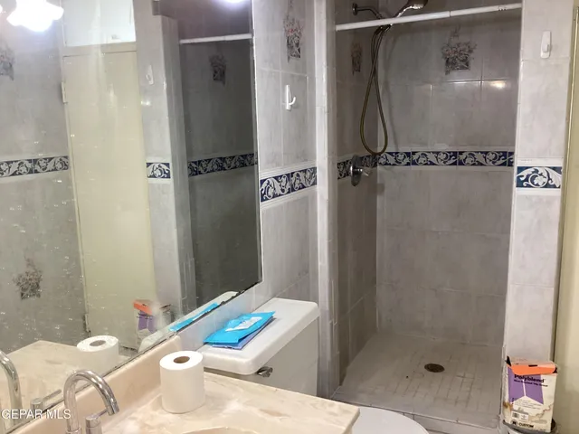 a bathroom with a sink and shower