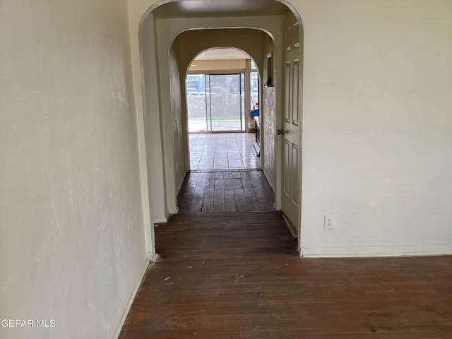 a view of a entryway door with a hallway