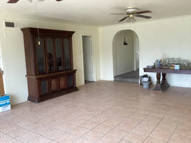 a view of a livingroom with furniture and staircase