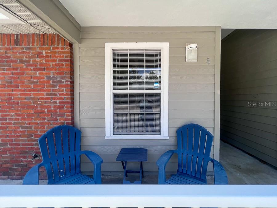 3911 Southwest 27th Street, Unit 8 Gainesville, FL 32608 - Photo 2 of 16 a view of dinning room with furniture and windows