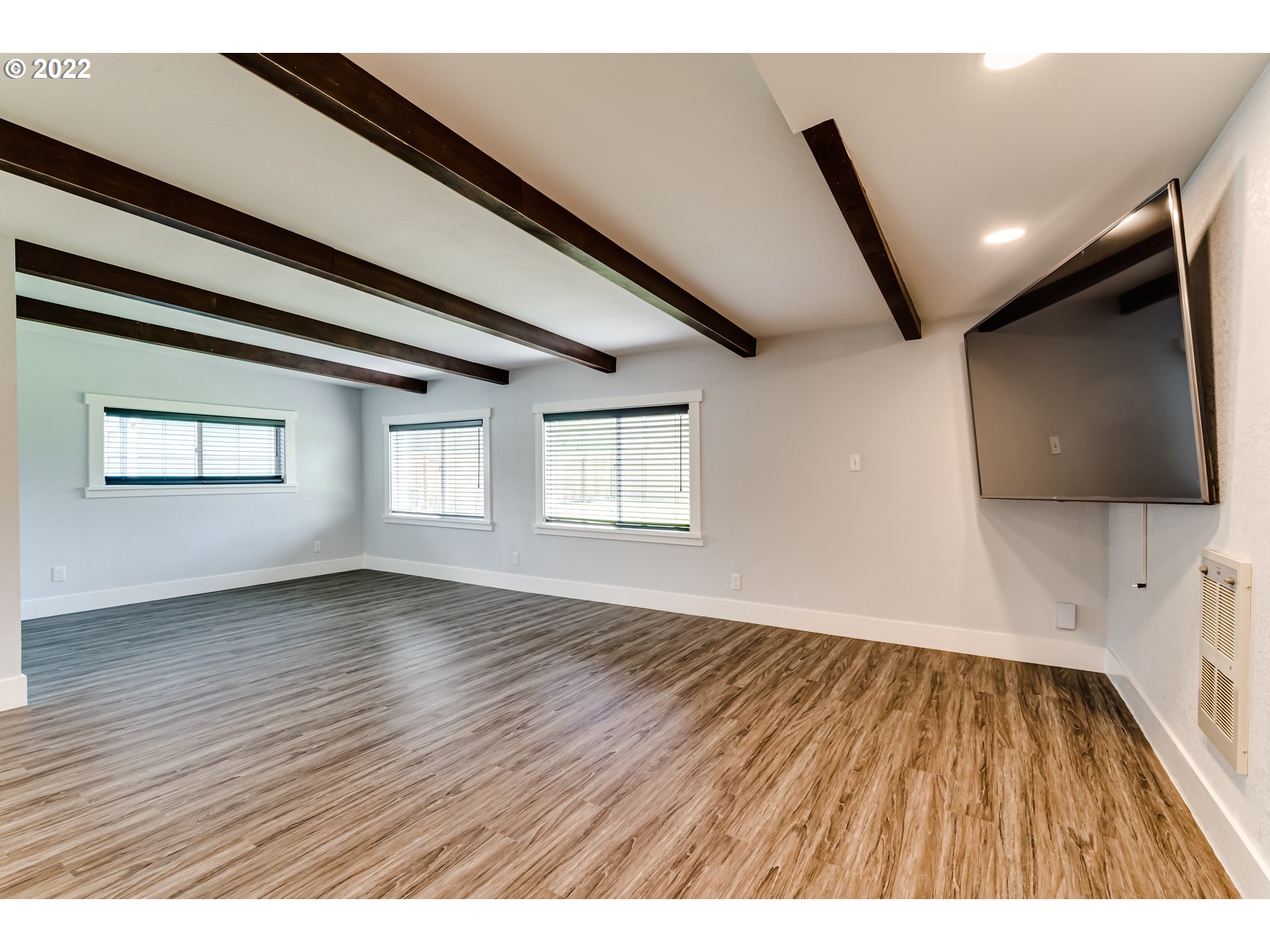 423 F Street Springfield, OR 97477 - Photo 11 of 29 an empty room with wooden floor and windows