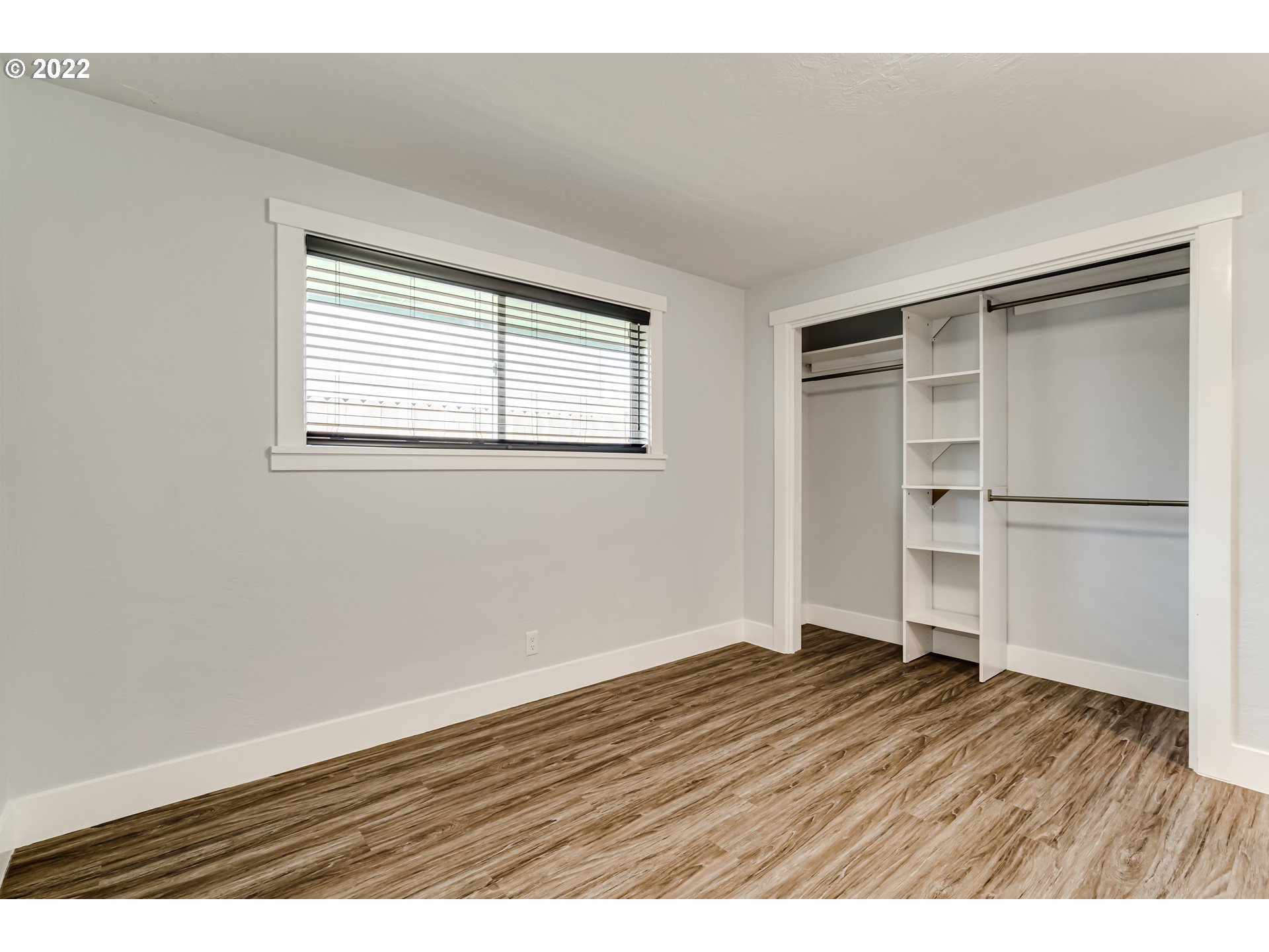 423 F Street Springfield, OR 97477 - Photo 12 of 29 a view of an empty room with wooden floor and a window