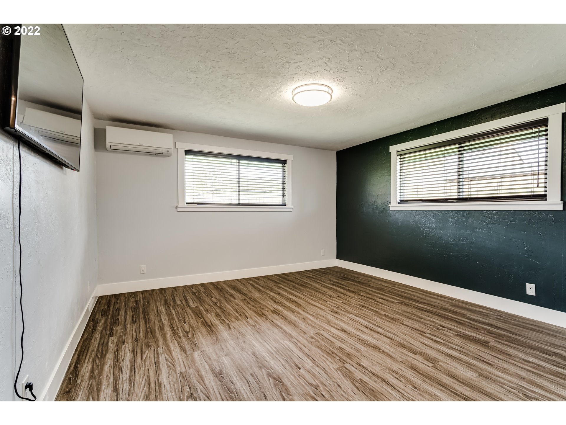 423 F Street Springfield, OR 97477 - Photo 14 of 29 a view of an empty room with wooden floor and a window