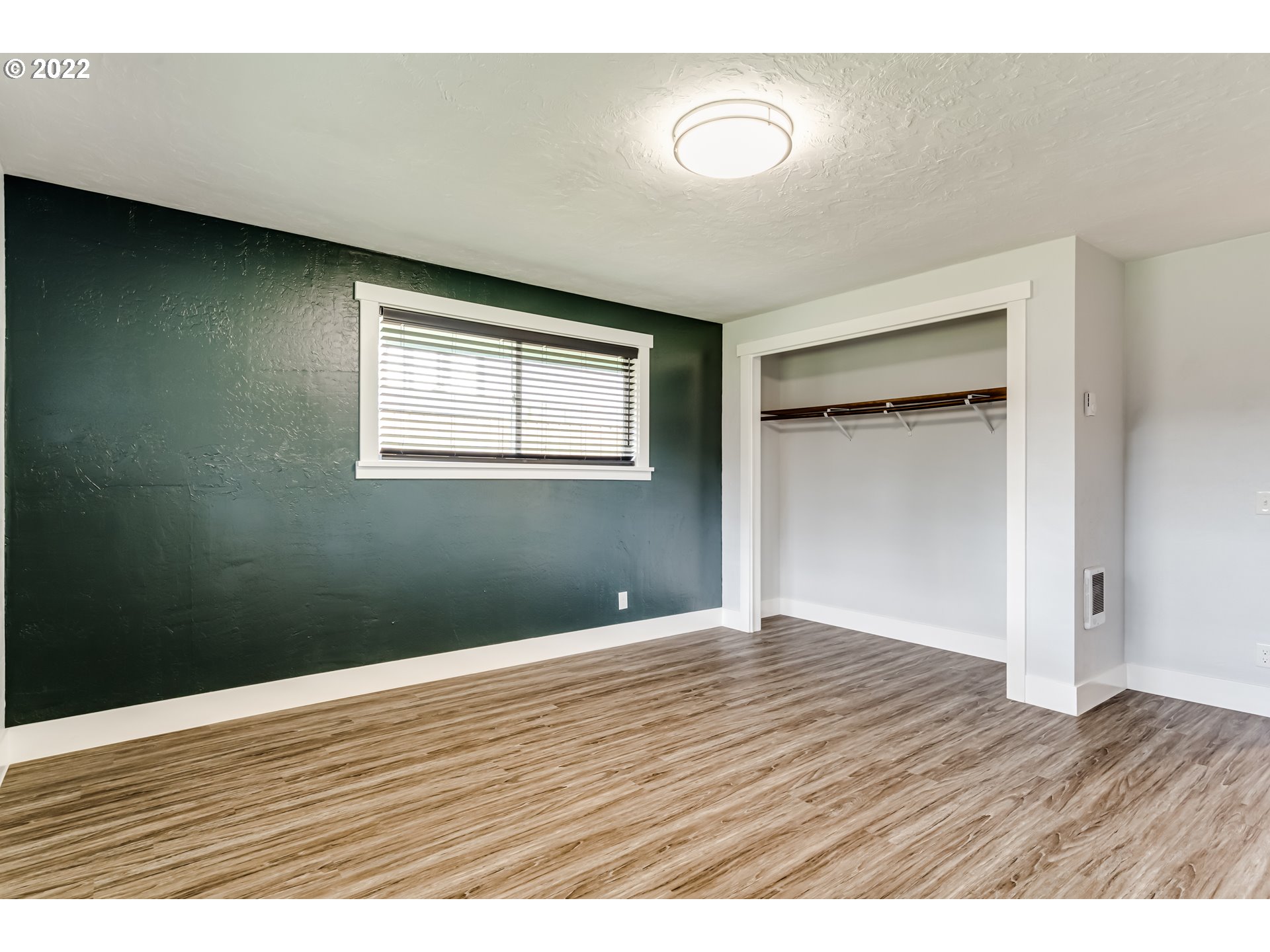 423 F Street Springfield, OR 97477 - Photo 15 of 29 a view of an empty room with wooden floor and a window