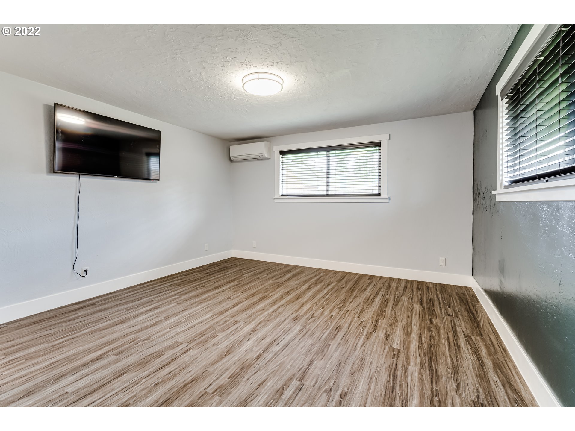 423 F Street Springfield, OR 97477 - Photo 16 of 29 a view of an empty room with wooden floor and a window